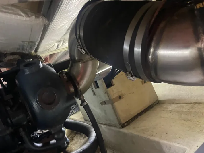  Yacht Photos Pics Engine compartment of a 1988 Bayliner 4588, showing exhaust system components.