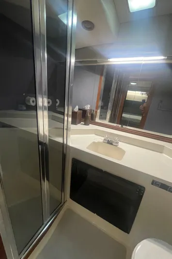  Yacht Photos Pics Bathroom interior of 1988 Bayliner 4588 yacht with shower and sink.