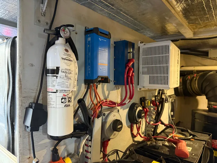 Captain & The Kids Yacht Photos Pics Electrical setup in a 1998 Carver 530 VOYAGER with fire extinguisher and wiring components.