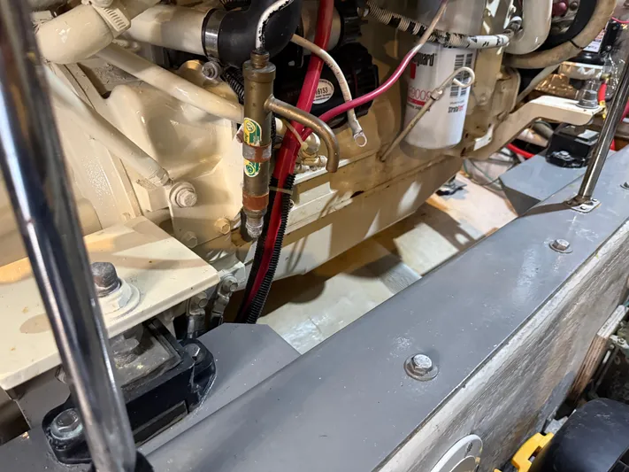 Captain & The Kids Yacht Photos Pics Engine compartment of a 1998 Carver 530 VOYAGER yacht, showcasing mechanical components.