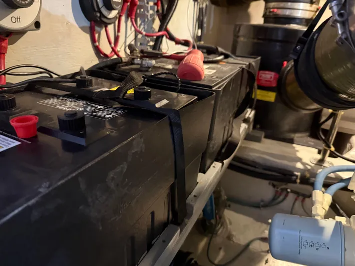 Captain & The Kids Yacht Photos Pics Battery compartment of a 1998 Carver 530 VOYAGER yacht, showing wiring and components.