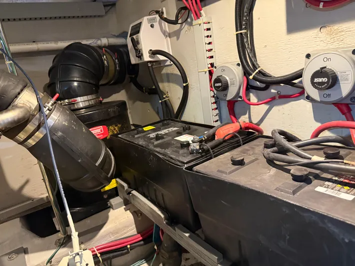 Captain & The Kids Yacht Photos Pics Engine room of 1998 Carver 530 Voyager with batteries and wiring.