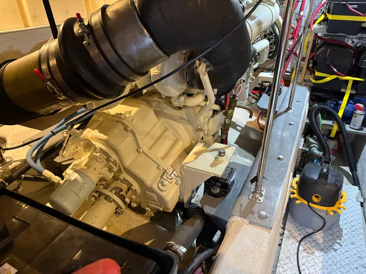 Captain & The Kids Yacht Photos Pics Engine room of 1998 Carver 530 VOYAGER yacht, showcasing mechanical components and equipment.