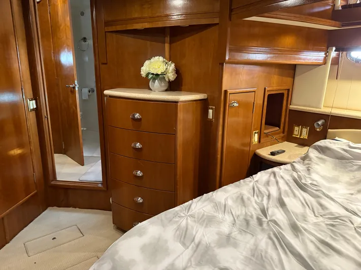 Captain & The Kids Yacht Photos Pics Luxurious 1998 Carver 530 Voyager yacht interior with wooden cabinetry and elegant decor.