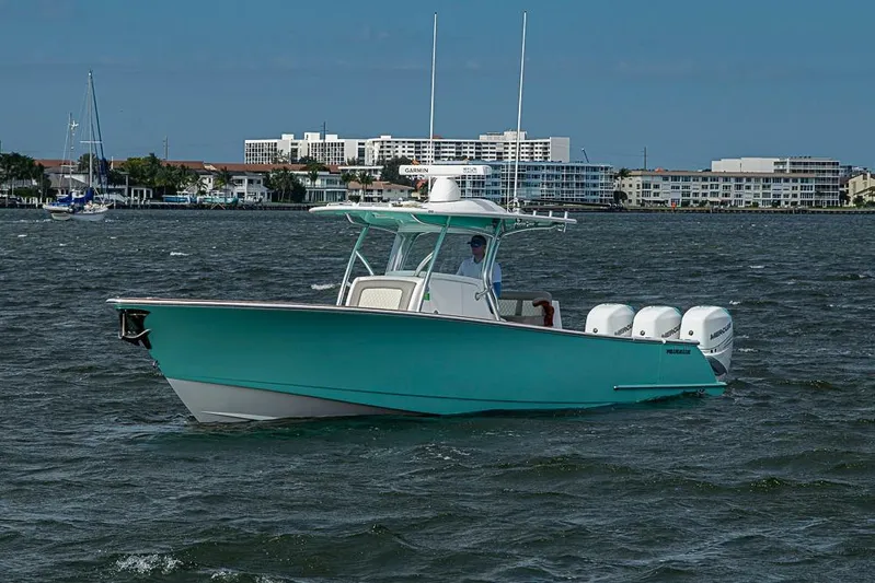 Eos Yacht Photos Pics 2020 Valhalla Boatworks V-37 cruising on water with cityscape background.