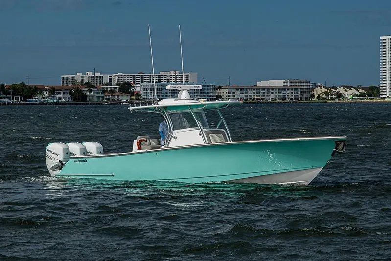 Eos Yacht Photos Pics 2020 Valhalla Boatworks V-37 cruising on water with cityscape background.