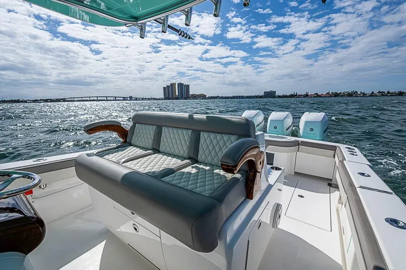 Eos Yacht Photos Pics 2020 Valhalla Boatworks V-37 on water, featuring luxurious seating and triple engines.