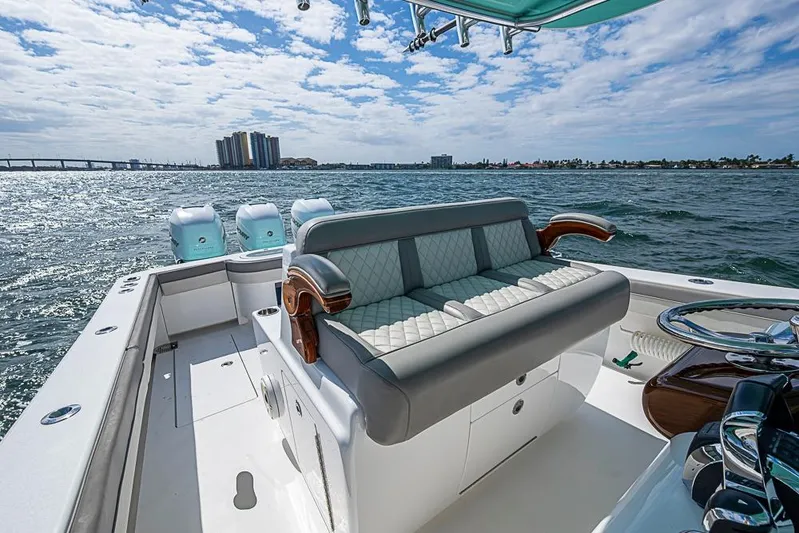 Eos Yacht Photos Pics 2020 Valhalla Boatworks V-37 on water, featuring luxurious seating and triple engines.