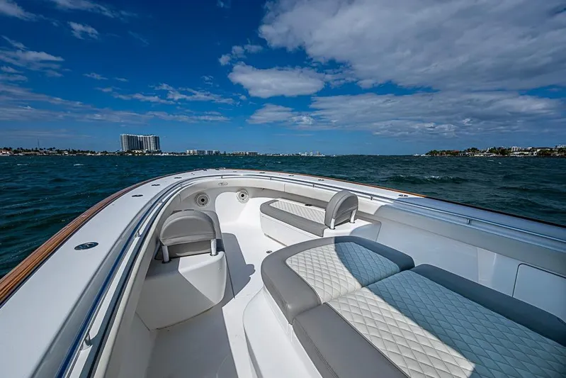 Eos Yacht Photos Pics 2020 Valhalla Boatworks V-37 cruising on open water under a partly cloudy sky.