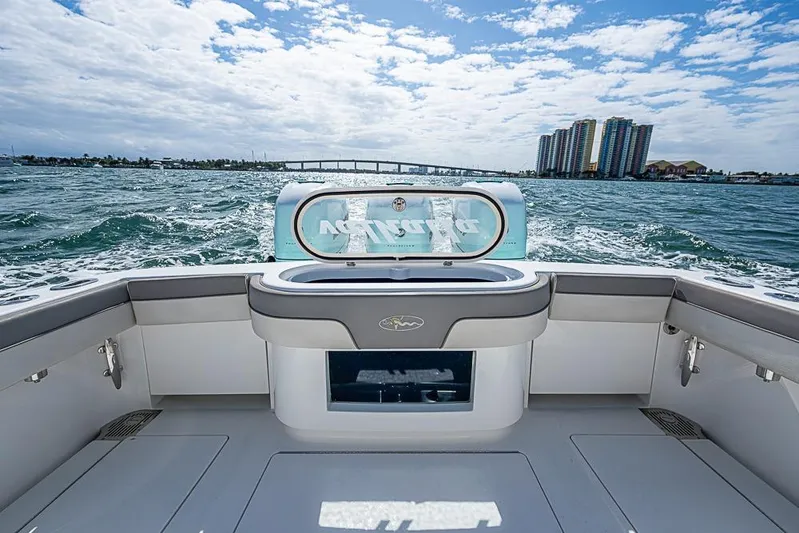 Eos Yacht Photos Pics 2020 Valhalla Boatworks V-37 on water, cityscape and bridge in background.