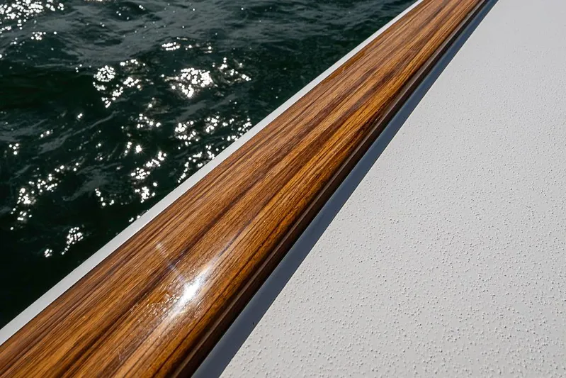 Eos Yacht Photos Pics Polished wood detail on 2020 Valhalla Boatworks V-37 against sparkling water.