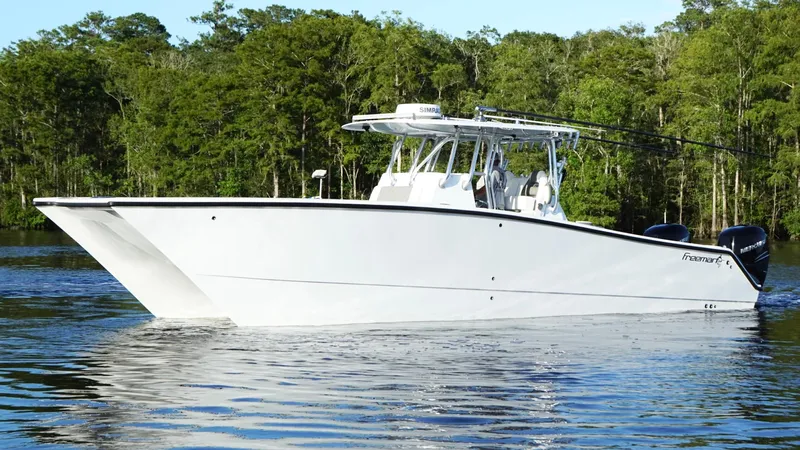  Yacht Photos Pics 2023 Freeman 34VH boat on calm water with forest background.