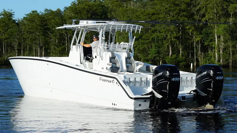  Yacht Photos Pics 2023 Freeman 34VH boat with dual Mercury 400 engines cruising on a lake.