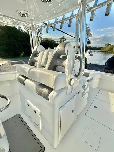  Yacht Photos Pics Luxury seating on a 2023 Freeman 34VH boat, featuring plush, diamond-stitched upholstery.