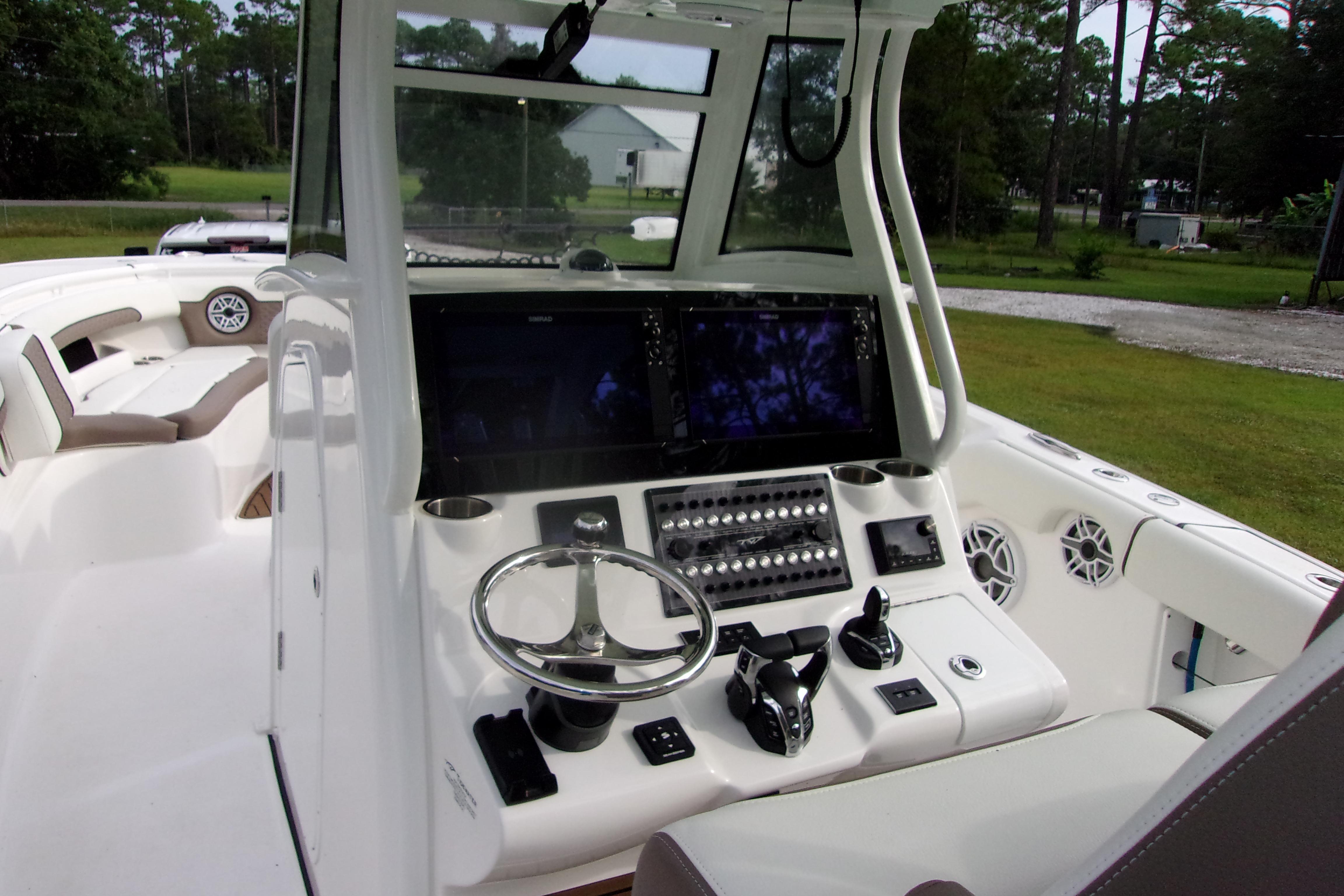 2025 Tidewater 320 CC Adventure boat cockpit with advanced controls and navigation system.
