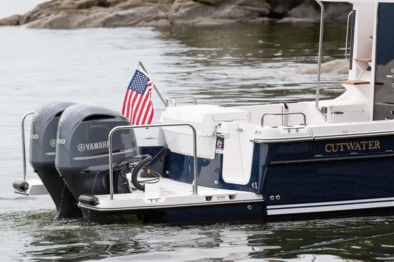  Yacht Photos Pics Manufacturer Provided Image: 2022 Cutwater C-32 CB boat with twin Yamaha engines and American flag.
