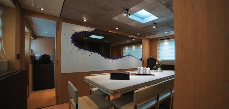  Yacht Photos Pics Luxurious interior of 2013 Sanlorenzo SL94 yacht with modern dining area and artistic wall design.