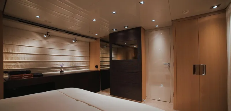  Yacht Photos Pics Luxurious bedroom interior of 2013 Sanlorenzo SL94 yacht with modern lighting and wood finishes.