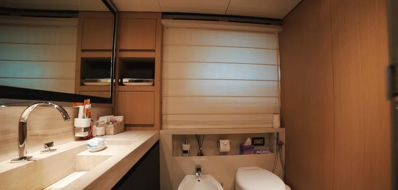  Yacht Photos Pics Luxurious bathroom in 2013 Sanlorenzo SL94 yacht with modern fixtures and wooden cabinetry.