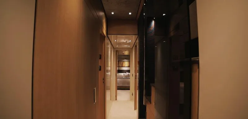  Yacht Photos Pics Luxurious interior hallway of 2013 Sanlorenzo SL94 yacht, featuring modern design and ambient lighting.