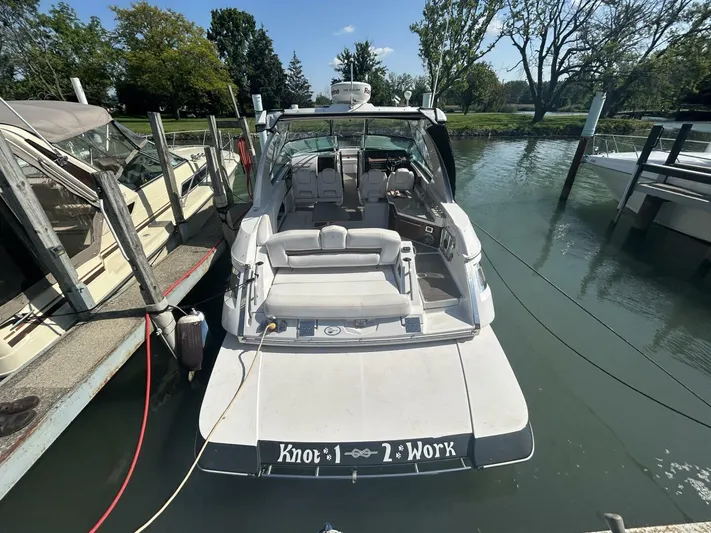  Yacht Photos Pics 2017 Four Winns H350 boat docked, rear view with "Knot 1 2 Work" text.