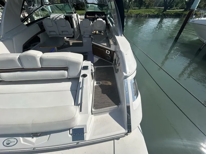  Yacht Photos Pics 2017 Four Winns H350 boat interior with white seating and sleek design by the water.