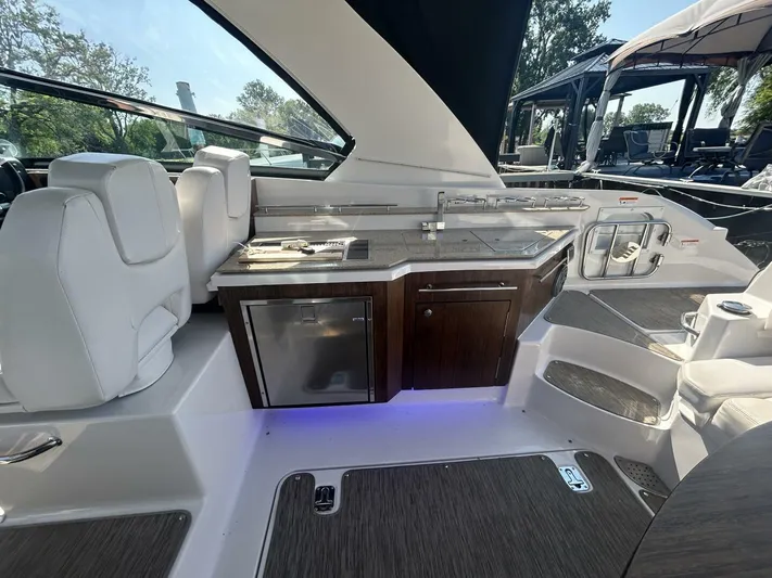  Yacht Photos Pics 2017 Four Winns H350 boat interior with kitchenette and seating area.