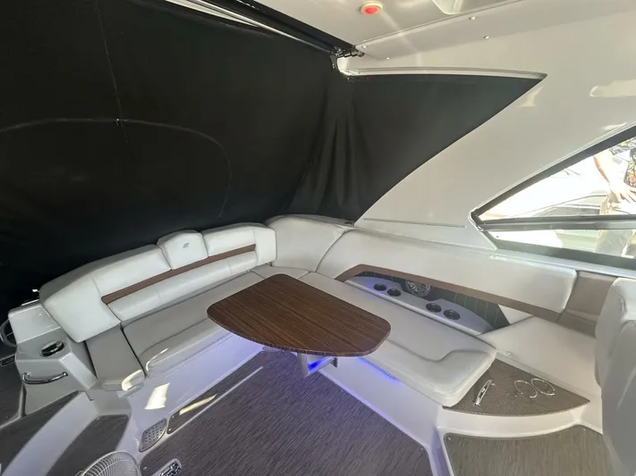  Yacht Photos Pics 2017 Four Winns H350 boat interior with sleek seating and wooden table.