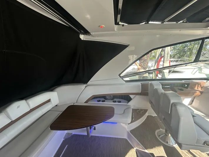  Yacht Photos Pics Interior of 2017 Four Winns H350 boat with seating and table.