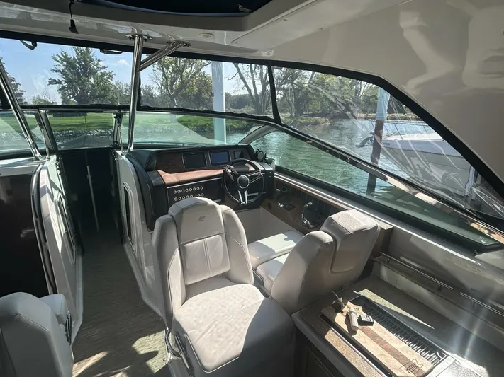  Yacht Photos Pics Interior of 2017 Four Winns H350 boat with steering wheel and seating.