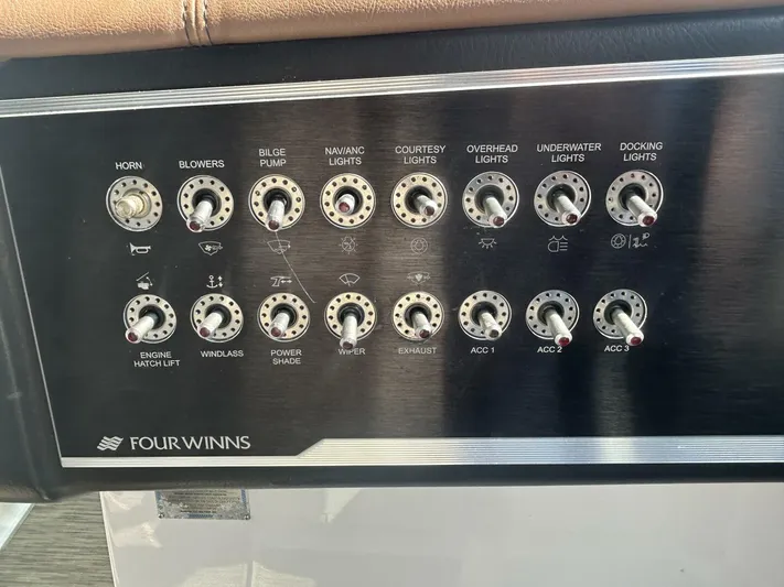  Yacht Photos Pics Control panel of a 2017 Four Winns H350 boat with labeled switches.