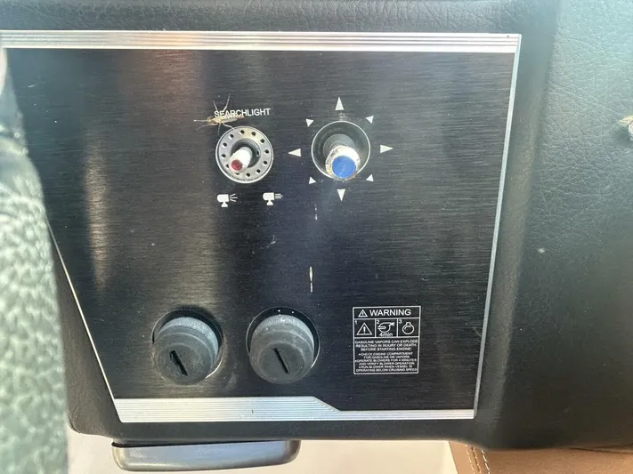  Yacht Photos Pics Control panel of a 2017 Four Winns H350 boat with searchlight and warning label.