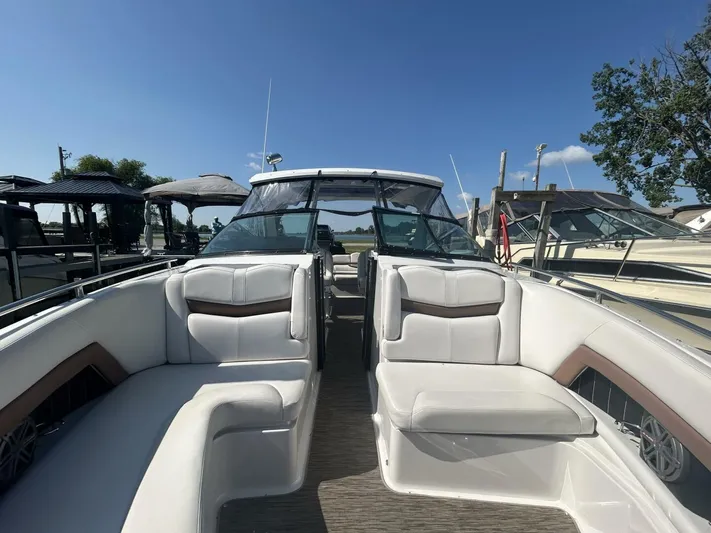  Yacht Photos Pics 2017 Four Winns H350 boat with spacious seating and sleek design, docked under clear skies.