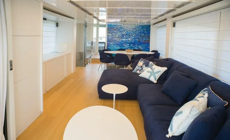  Yacht Photos Pics Luxurious interior of 2022 Cranchi Settantotto 78 yacht with modern decor and blue accents.