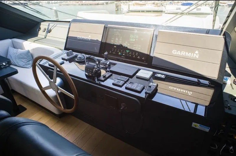  Yacht Photos Pics 2022 Cranchi Settantotto 78 yacht helm with Garmin navigation system and luxurious seating.