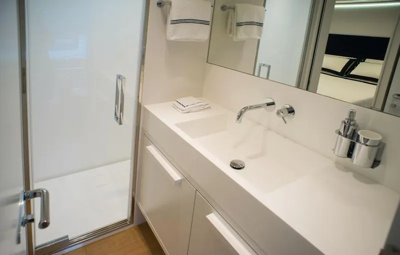  Yacht Photos Pics Modern bathroom in 2022 Cranchi Settantotto 78 yacht with sleek white fixtures.