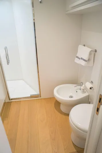  Yacht Photos Pics Modern bathroom in 2022 Cranchi Settantotto 78 yacht with shower, toilet, and bidet.