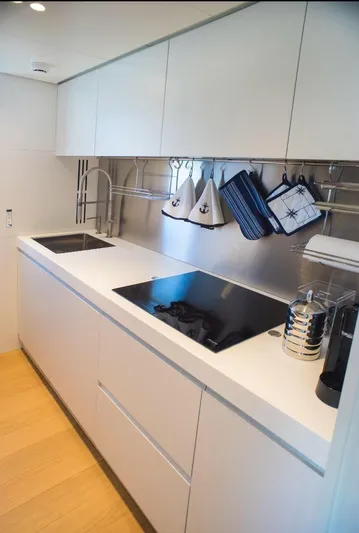  Yacht Photos Pics Modern kitchen in 2022 Cranchi Settantotto 78 yacht with sleek design and nautical decor.