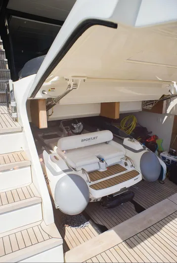  Yacht Photos Pics 2022 Cranchi Settantotto 78 yacht with SportJet tender in storage compartment.