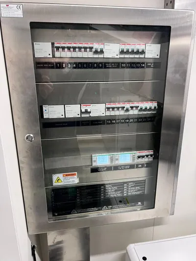  Yacht Photos Pics Electrical panel on a 2022 Cranchi Settantotto 78 yacht, featuring multiple circuit breakers.