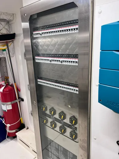  Yacht Photos Pics Electrical panel on 2022 Cranchi Settantotto 78 yacht, featuring circuit breakers and switches.