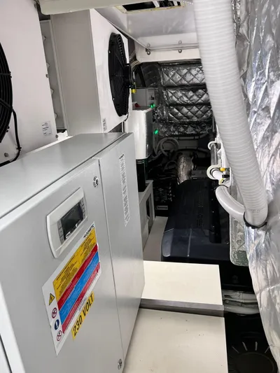  Yacht Photos Pics Engine room of 2022 Cranchi Settantotto 78 yacht, featuring modern equipment and insulation.