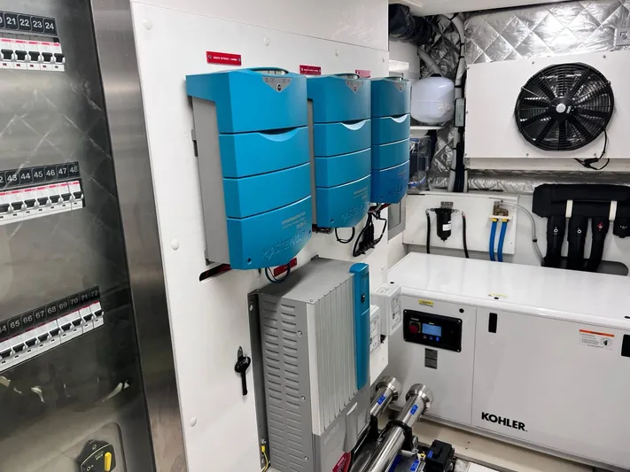  Yacht Photos Pics Engine room of 2022 Cranchi Settantotto 78 yacht with electrical systems and Kohler generator.