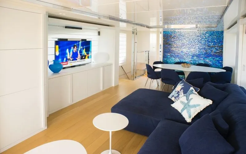  Yacht Photos Pics Luxurious interior of 2022 Cranchi Settantotto 78 yacht with modern decor and cozy seating.