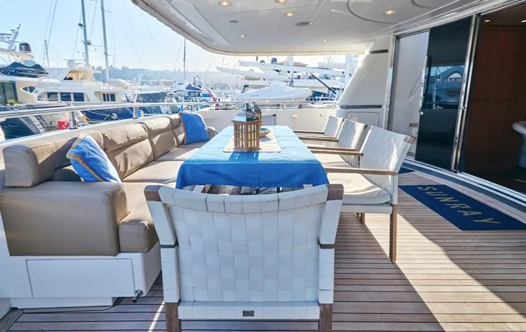  Yacht Photos Pics Luxurious 2009 Sanlorenzo SL88 yacht deck with elegant seating and dining area.