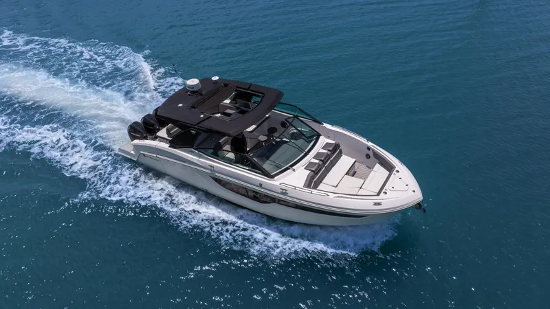  Yacht Photos Pics 2020 Cruisers Yachts 38 GLS OB cruising on clear blue water.