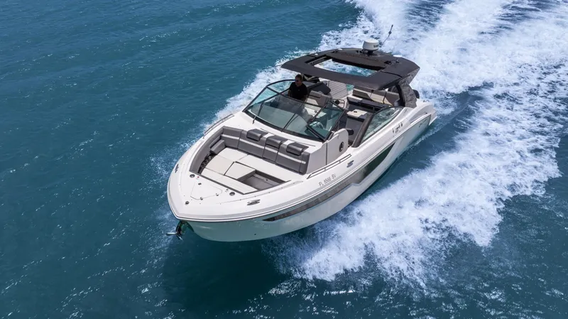  Yacht Photos Pics 2020 Cruisers Yachts 38 GLS OB cruising on open water, showcasing sleek design and performance.