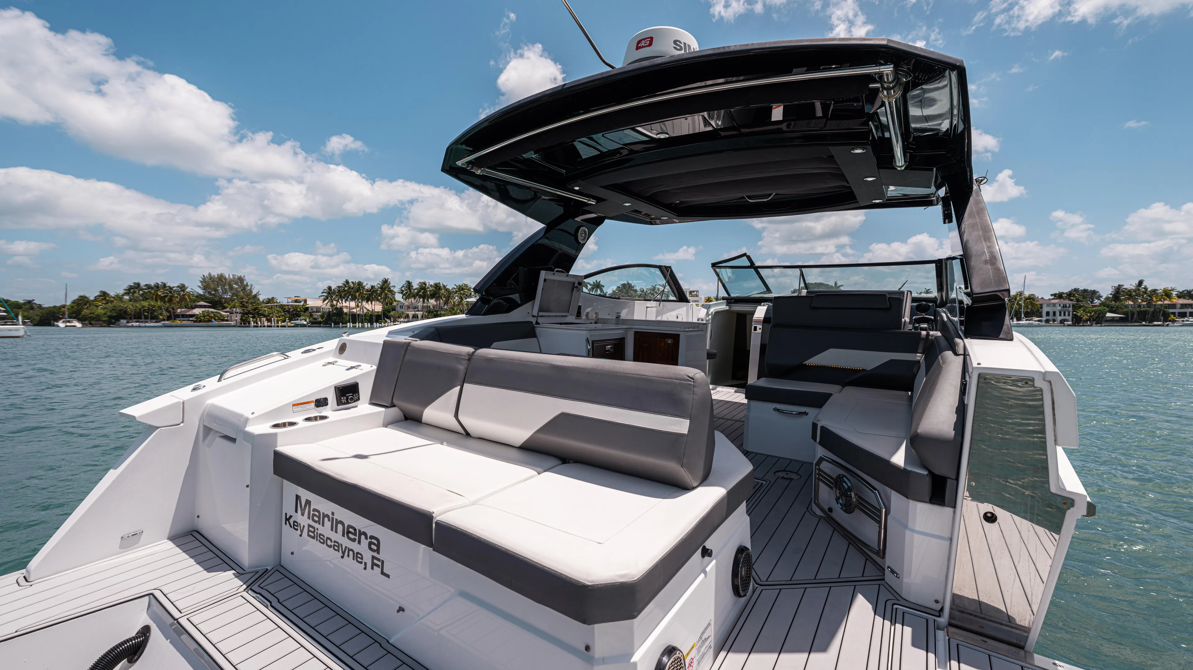  Yacht Photos Pics 2020 Cruisers Yachts 38 GLS OB on water, featuring spacious seating and sleek design.