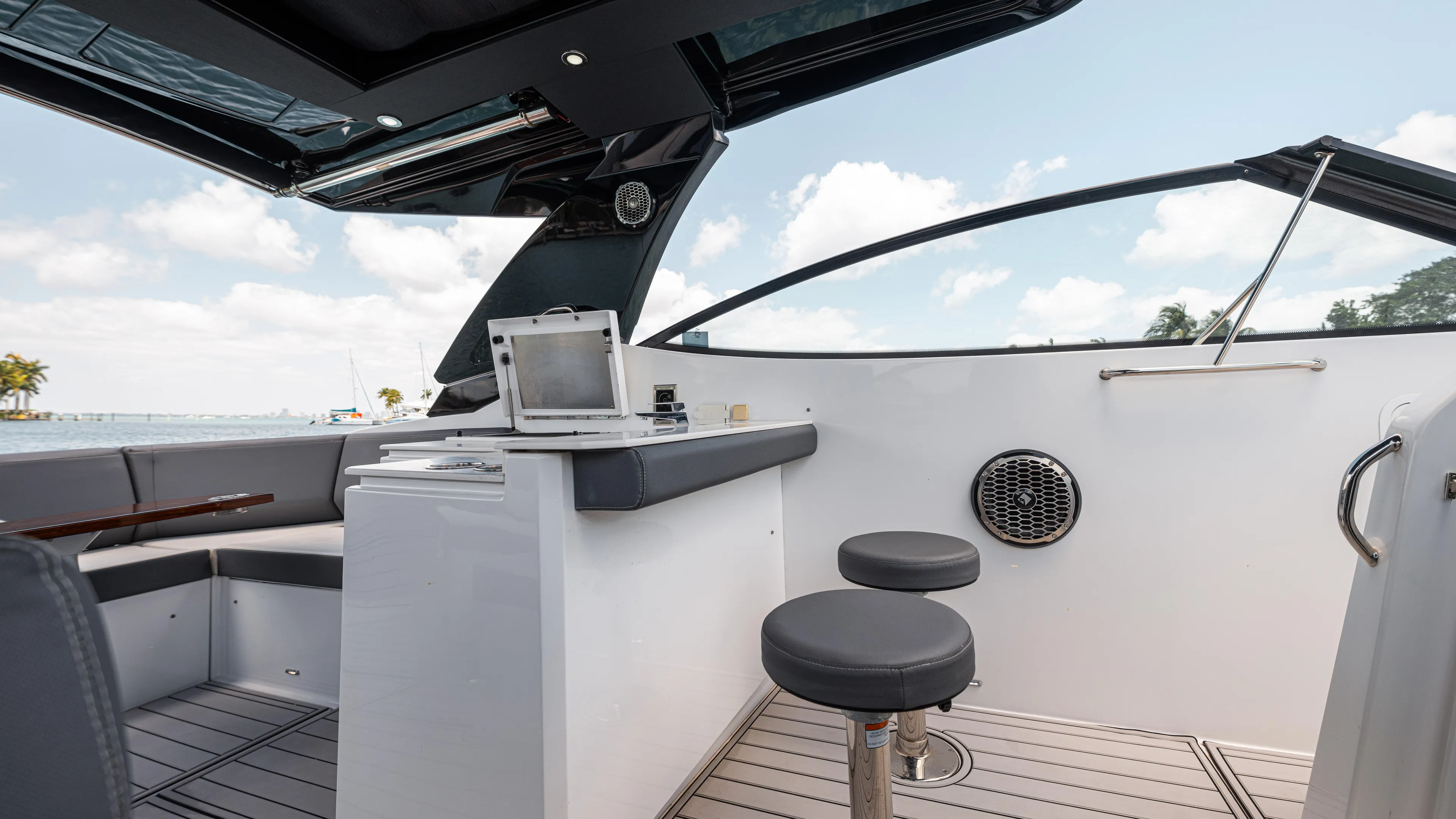  Yacht Photos Pics 2020 Cruisers Yachts 38 GLS OB interior with seating, table, and open-air design.