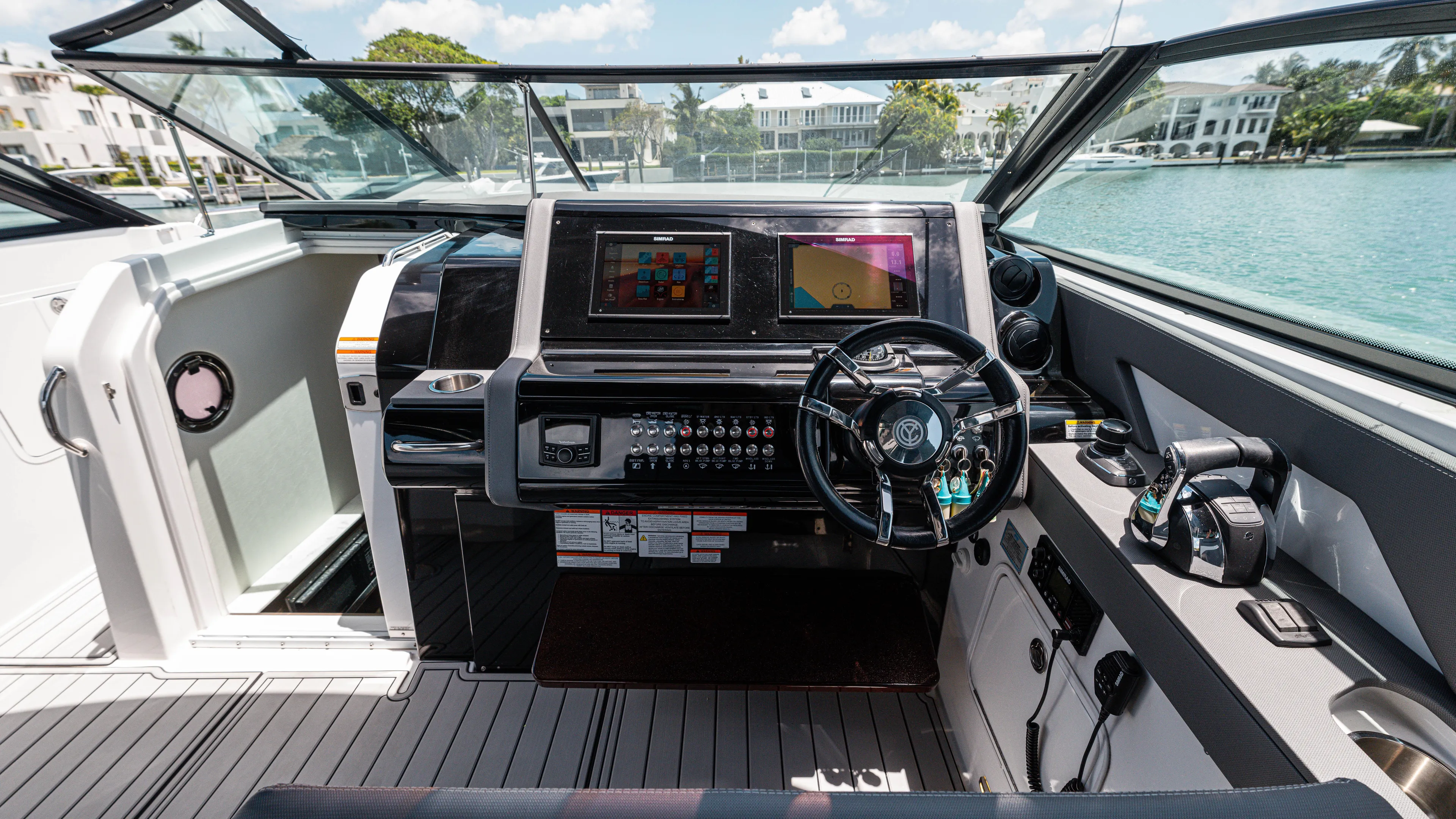  Yacht Photos Pics Cockpit of 2020 Cruisers Yachts 38 GLS OB with modern controls and dual displays.